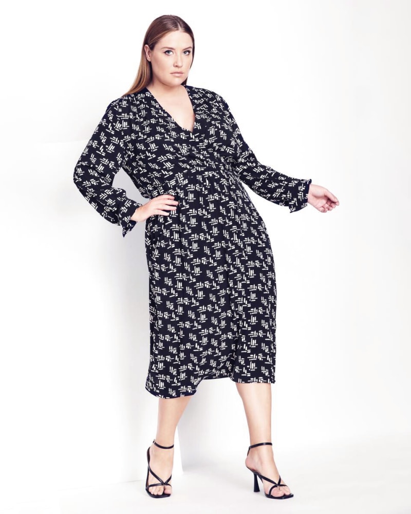 Plus size model wearing New Weave Midi Dress by Refinity | Dia&Co | dia_product_style_image_id:172233